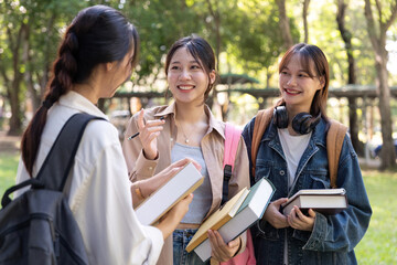Happy young student chat with each other after class. Guy and girls wear casual clothes to study. Lifestyle concept, sincere emotions