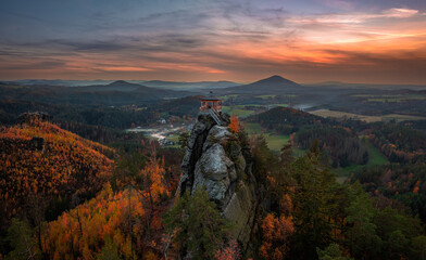 Jetrichovice, Czech Republic - Aerial panoramic view of Mariina Vyhlidka (Mary's view) lookout with a beautiful Czech autumn landscape and colorful golden sunset sky in Bohemian Switzerland region