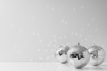 Beautiful disco balls on a light background