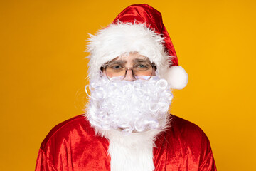 Fototapeta na wymiar Santa Claus, portrait on a yellow background.