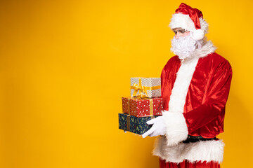 Santa Claus, with gift boxes in his hands.