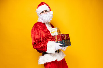 Santa Claus, with gift boxes in his hands.