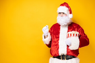 Fototapeta na wymiar Santa Claus, a cheerful Santa with popcorn in his hands.