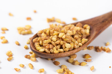 dry buckwheat on white background.
