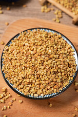 dry buckwheat on wooden background.