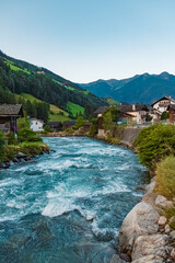 Fototapeta na wymiar Alpine sunrise with the river Ahr at St Johann, San Giovanni, Ahrntal valley, Pustertal, Trentino, Bozen, South Tyrol