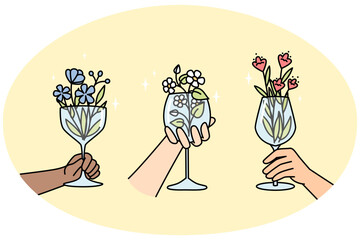 Hands of multiracial people hold wineglasses with flowers inside. Creative blossom plant arrangement in glassware for interior, party. Floral drink, lemonade, cocktail in wine glasses vector concept.