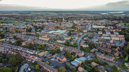 Aerial view 4k small town at sunset in Rutland, UK. 
