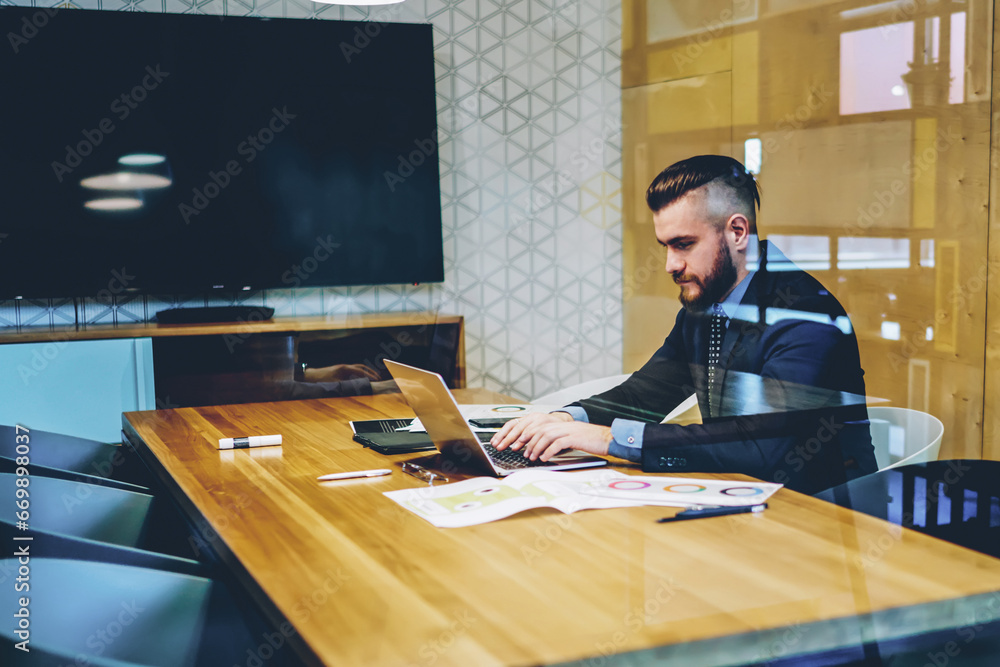 Poster male trader working at computer in search information on website