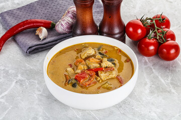 Traditional yellow Thai curry with chicken