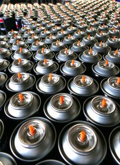 Aerosol cans being manufactured in production factory