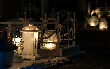 candles on the cemetery on the grave at night, all Saints Day 4