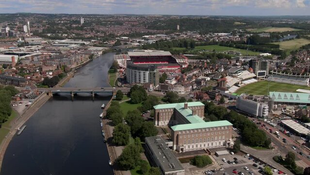 Drone view of River Trent and Nottingham, England on sunny afternoon.