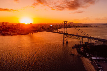 Cable bridge with sunset in Florianopolis, Brazil. Aerial view