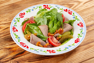 gourmet salad on the wooden background