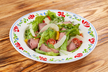 gourmet salad on the wooden background