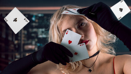 woman in red dress throw fly playing cards  in casino game