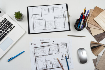 Naklejka na ściany i meble Architectural materials blueprints laptop tools and color sampler for renovation