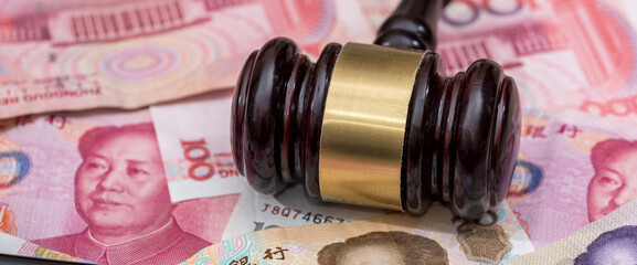 yuan on wooden hammer . close up.