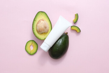 Beauty product packaging design templates based on avocado. On a pink background, a white plastic...