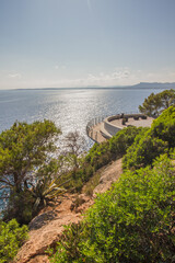 Mediterranean seascape with view point Cap del Pinar and pine trees near Costa de los pinos, Cala Millor, Mallorca island, Spain (vertical)