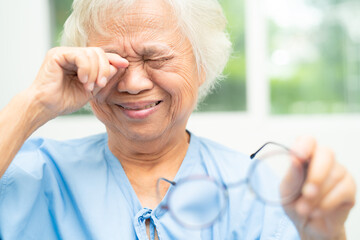 Asian senior old woman patient feel sad and cry when pain from sick for lonely depression in...
