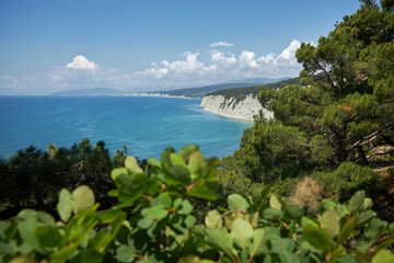 Blue azure sea against a background of white sheer cliffs. Seascape of coastline, beautiful nature, landscape. Tourism travel