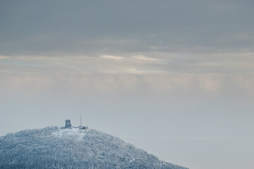 Medieval castle on top of a mountain in winter