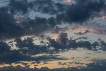Dramatic cumulus clouds on summer evening. Atmosphere background or wallpaper