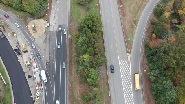 Drone footage over Donald Lynch Boulevard and Route 495 in Marlboro, Massachusetts. On off ramps and road construction visible on the sides.