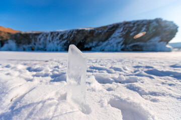 Fototapeta na wymiar Clear water Winter landscape frozen lake Baikal and ice caves and grottoes on sunny day