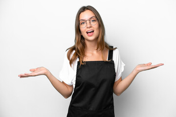 Young caucasian restaurant waiter woman isolated on white background with shocked facial expression