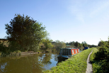 Moored narrow boats on the Trent and Mersey canal in Cheshire UK