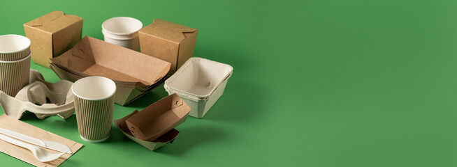 Packaging concept - selection of paper craft packaging on green