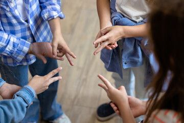 Kids playing finger game at break at school