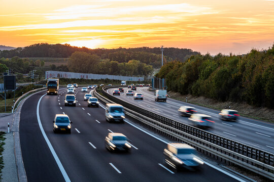 Germany, Baden-Wurttemberg, Kirchheim unter Teck, Traffic on Bundesautobahn 8 at sunset