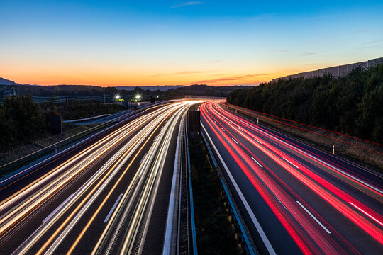 Germany, Baden-Wurttemberg, Kirchheim unter Teck, Vehicle light trails on Bundesautobahn 8 at dusk