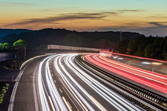Germany, Baden-Wurttemberg, Kirchheim unter Teck, Vehicle light trails on Bundesautobahn 8 at dusk