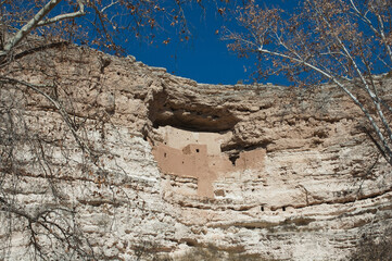 Camp Verde, Arizona, United States – January 22 2006: This stone dwelling built into a shallow cave in a cliff face was once a six-story building with 45 rooms.