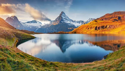 Poster panoramic morning view of bachalp lake bachalpsee switzerland majestic autumn scene of swiss alps grindelwald bernese oberland europe beauty of nature concept background © Nichole