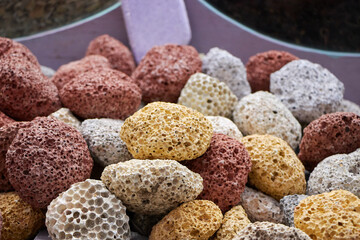 Texture of colored pumice stones for foot care. Colorful pumices in different sizes.