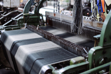 Close-up of a textile loom in a textile factory.