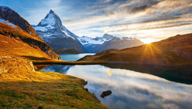 fantastic evening panorama of bachalp lake bachalpsee switzerland picturesque autumn sunset in swiss alps grindelwald bernese oberland europe beauty of nature concept background