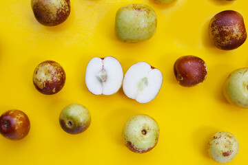 Fresh jujube fruit on yellow background