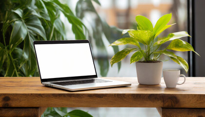 wooden table with laptop white screen and a cup of coffee complemented by a vibrant potted plant blurred background high quality photo
