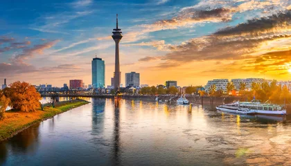 Foto op Canvas incredible autumn sunset on the rhein river spectacular evening cityscape of dusseldorf with medienhafen nordrhein westfalen germany europe traveling concept background © Nichole