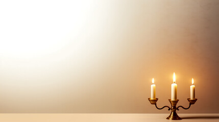 Vintage candles in golden candlestick on a blurred background.