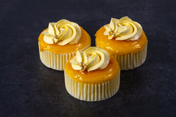 cupcake with cream on grey cement background. with clipping path