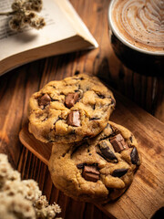 Cookies are arranged messily on a wooden placemat, isolated with a wooden table background.