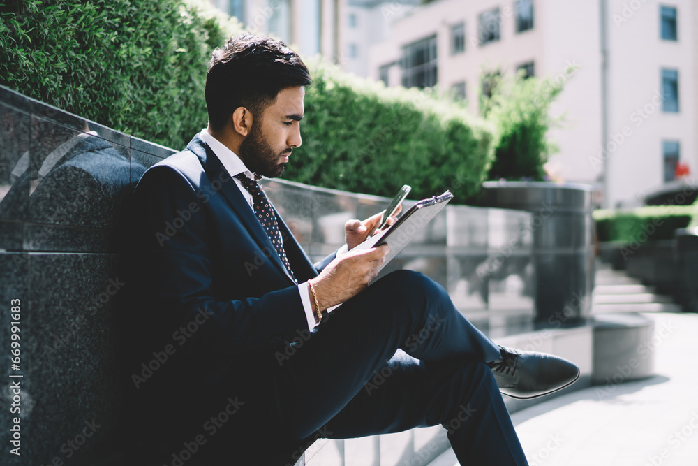 Poster man reading incoming email via application on cellphone with 4g